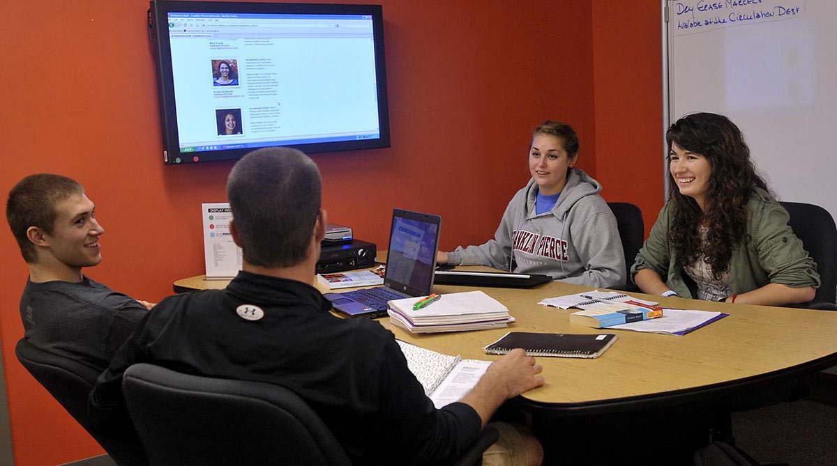 Undergraduate students meeting for class homework at Franklin Pierce University.